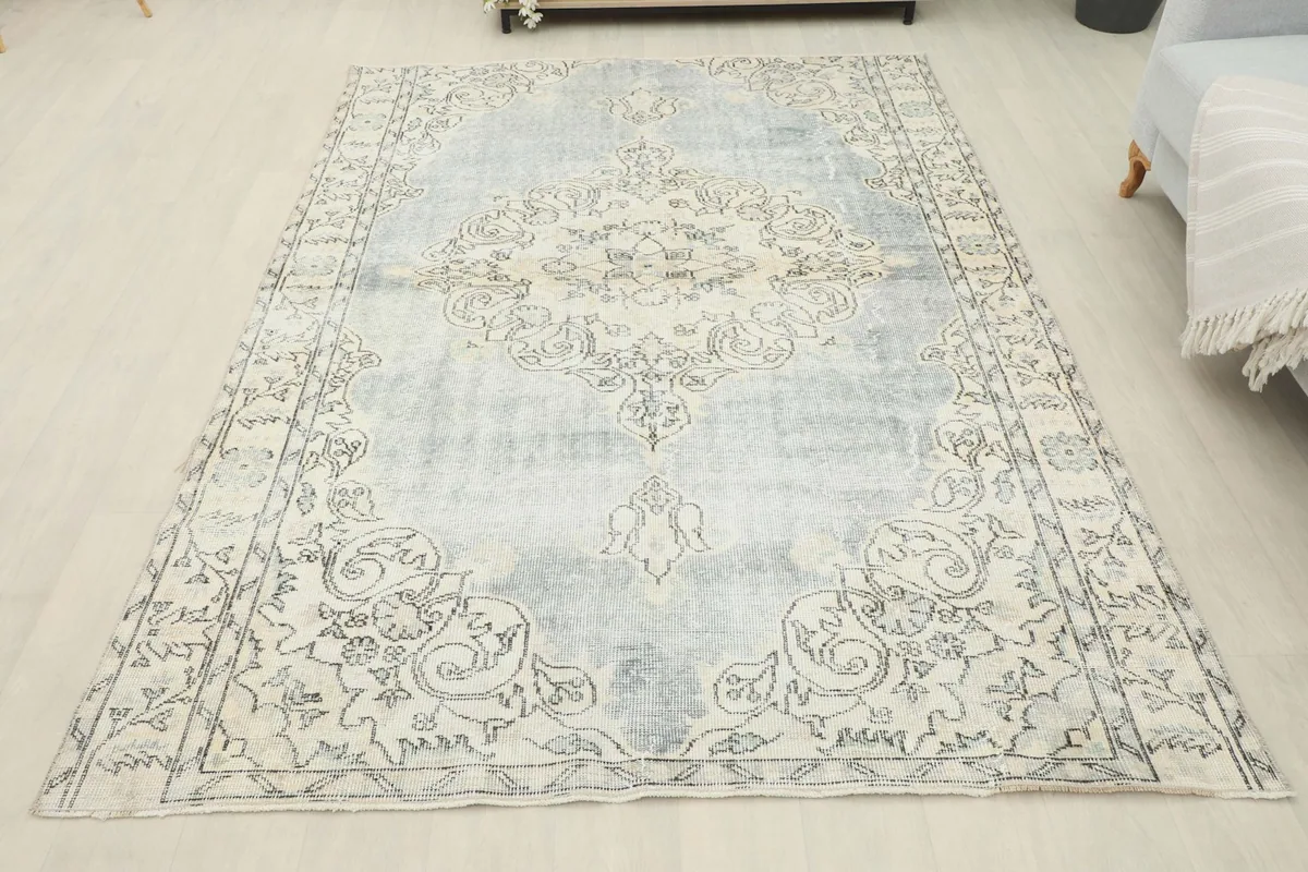 Full overhead view of the vintage rug, showcasing its overall size and design in a room