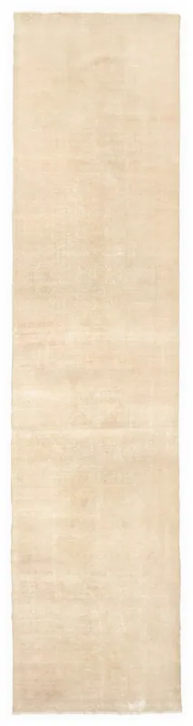 Full overhead view of the 3x13 muted tan vintage runner rug on a white background.