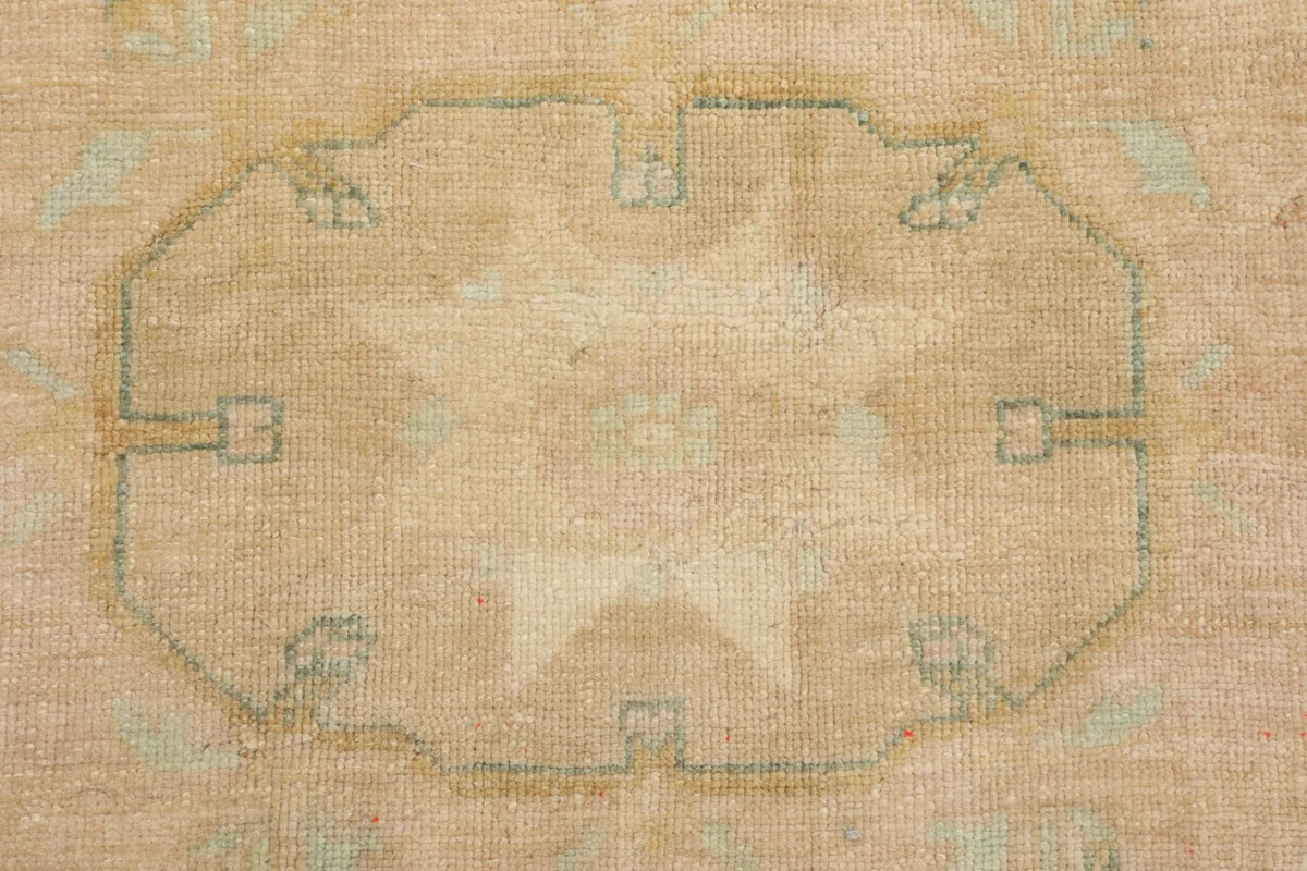 Detailed view of a geometric medallion, outlining its shape and subtle color shifts