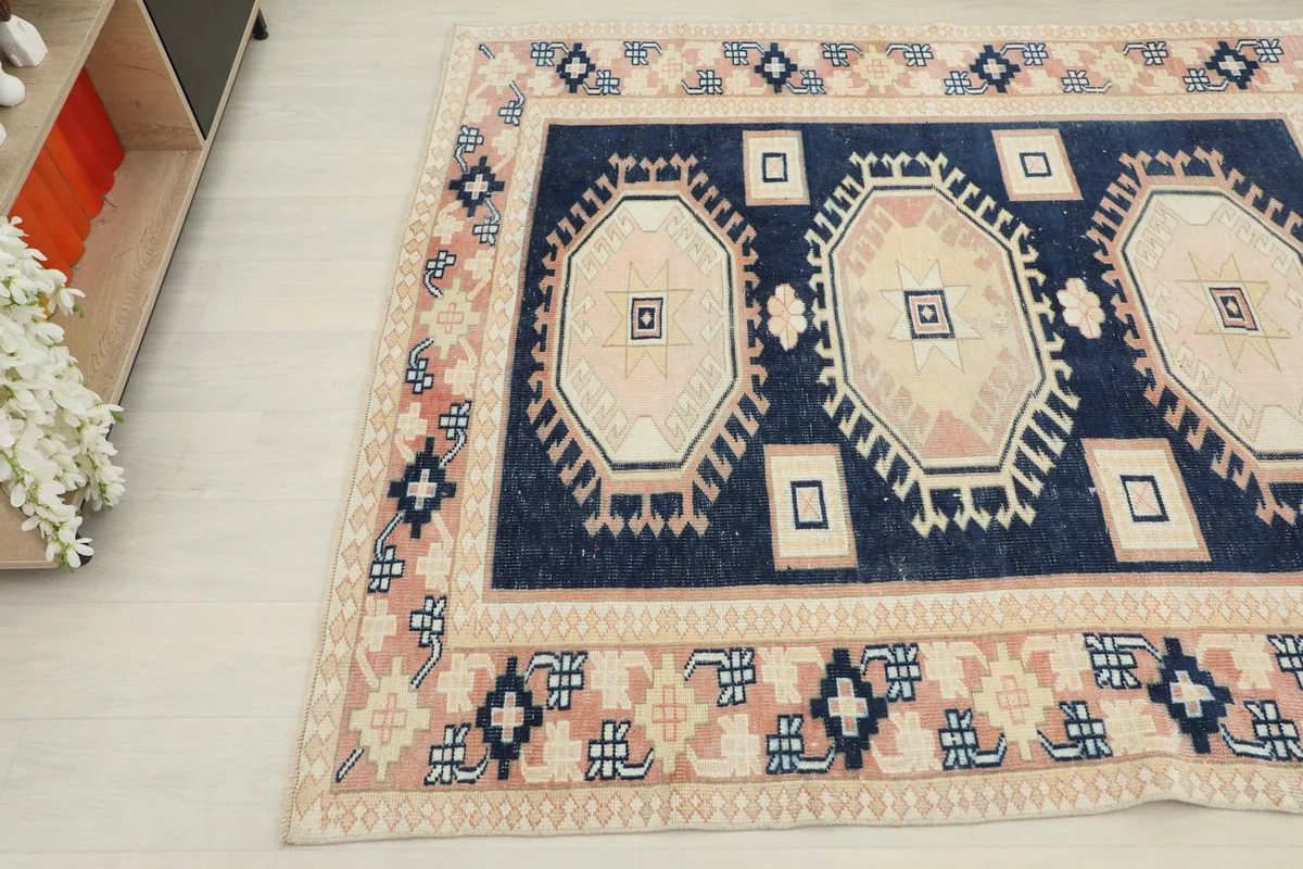 Overhead angle showing the rug's patterns and colors from a slightly elevated perspective.