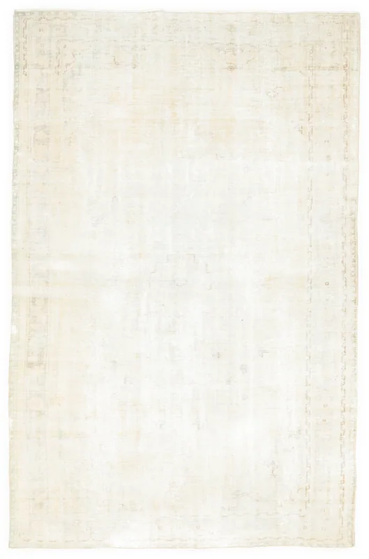 Full overhead view of the 6'5" x 9'11" ivory vintage Anatolian rug on a white background.