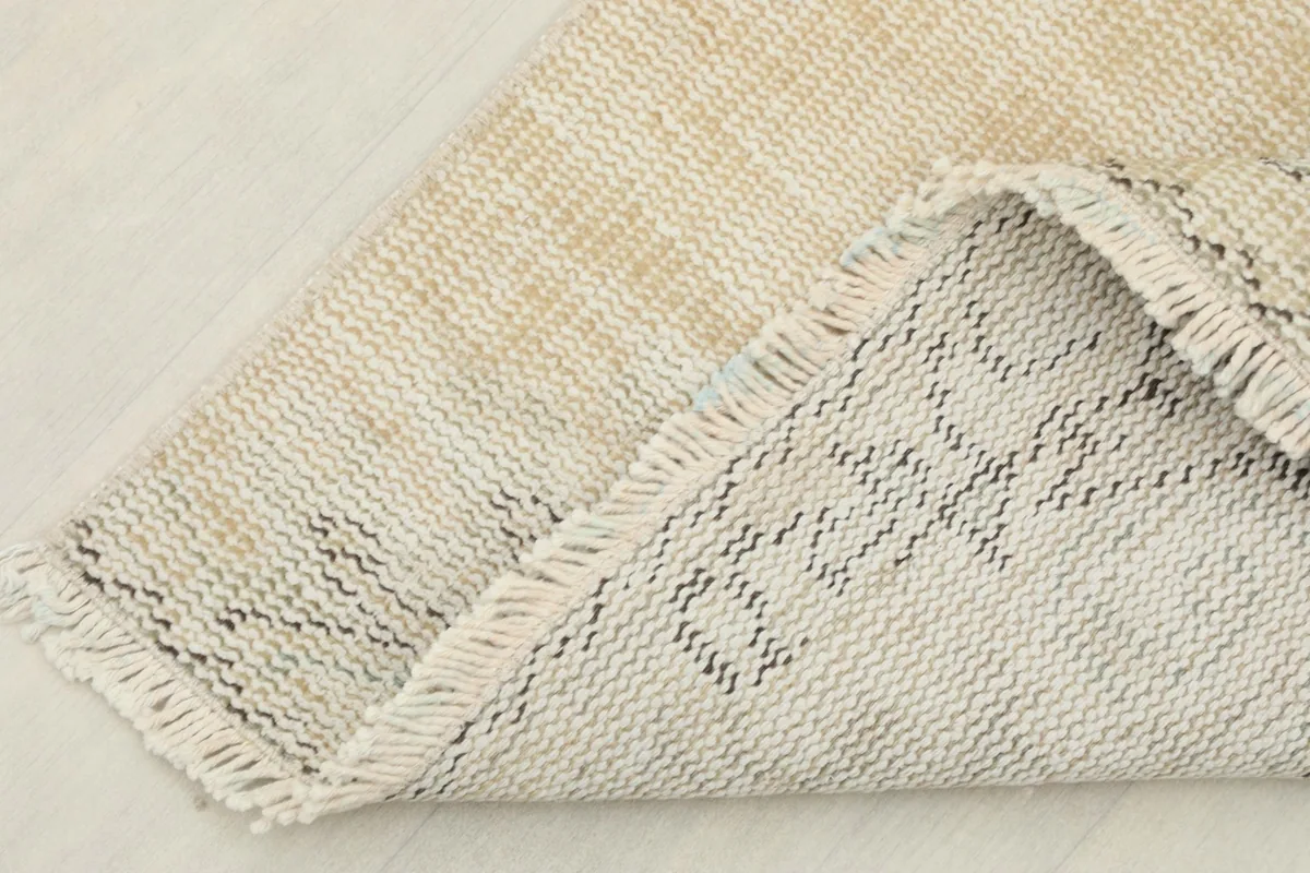 View of the back of the runner, showing the cotton foundation and hand-knotting