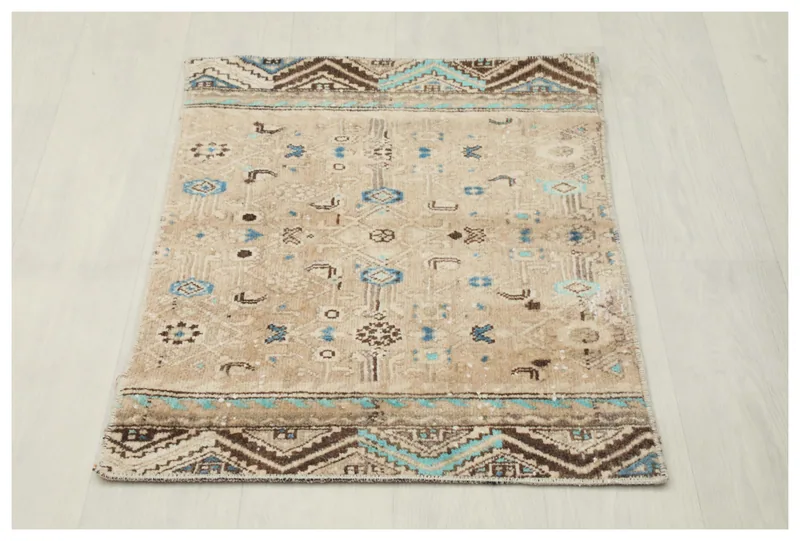 Full top view of the 2x3 vintage Anatolian rug with tan field and blue geometric patterns