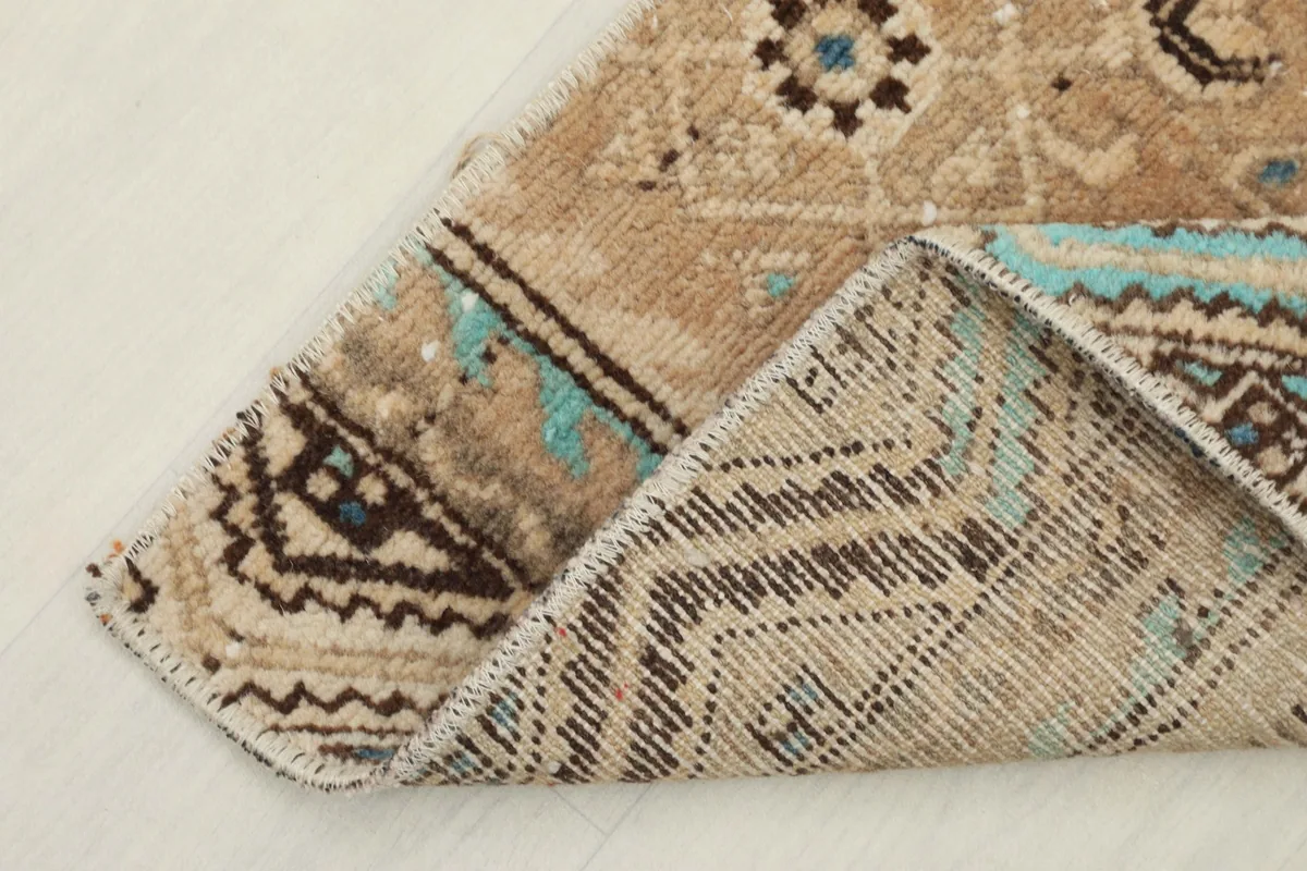 Close-up of the back of the rug, revealing the hand-knotted construction and foundation