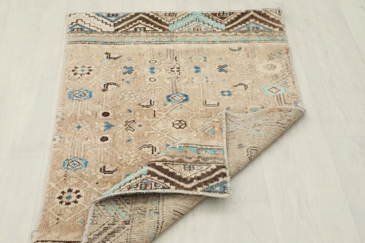 View of the rug with a corner folded back, showing the cotton foundation