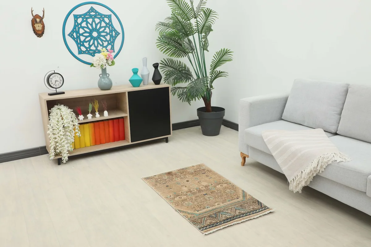 Tan and blue mini area rug placed in a modern living room setting