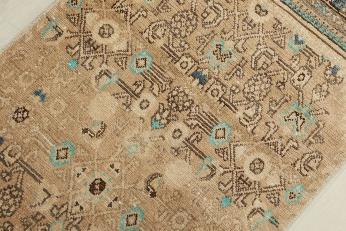 Close-up of the hand-knotted wool pile and intricate geometric designs