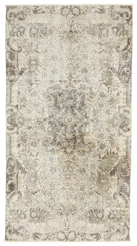 Full overhead view of the ivory floral medallion vintage Anatolian rug