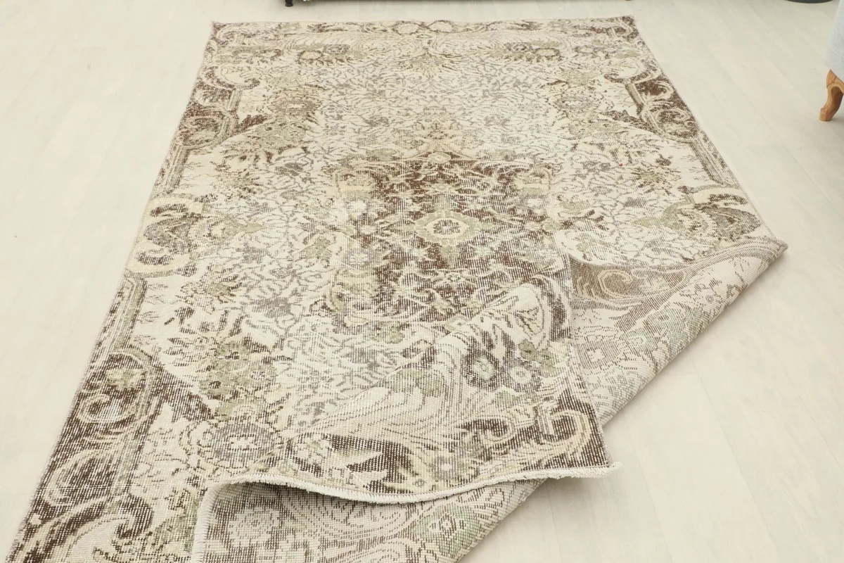 Rug corner folded back, displaying the reverse side and the overall pattern