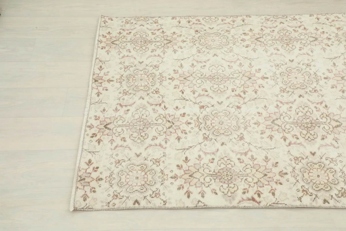 Another close-up showing the intricate floral and geometric patterns of the rug
