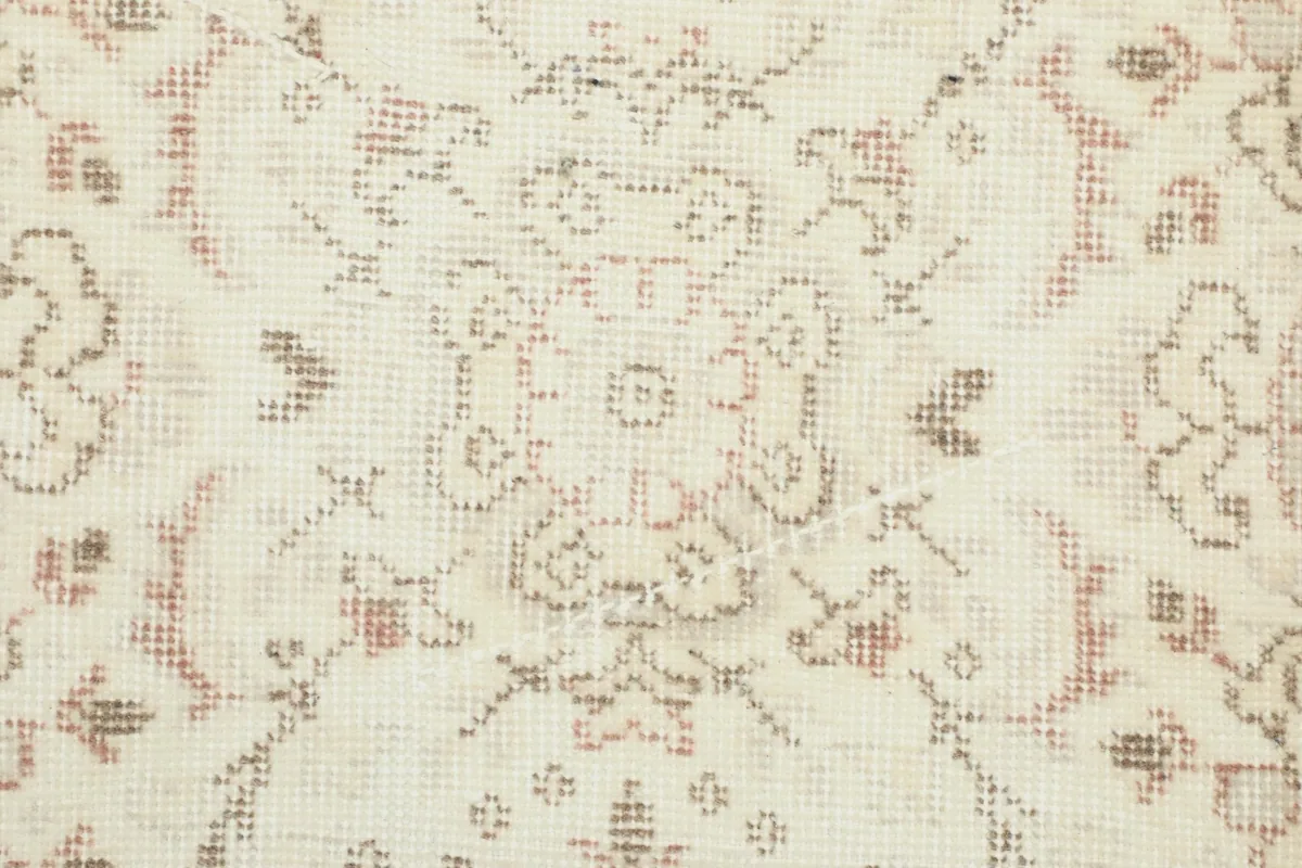 Extreme close-up revealing the hand-knotted wool pile and subtle color variations