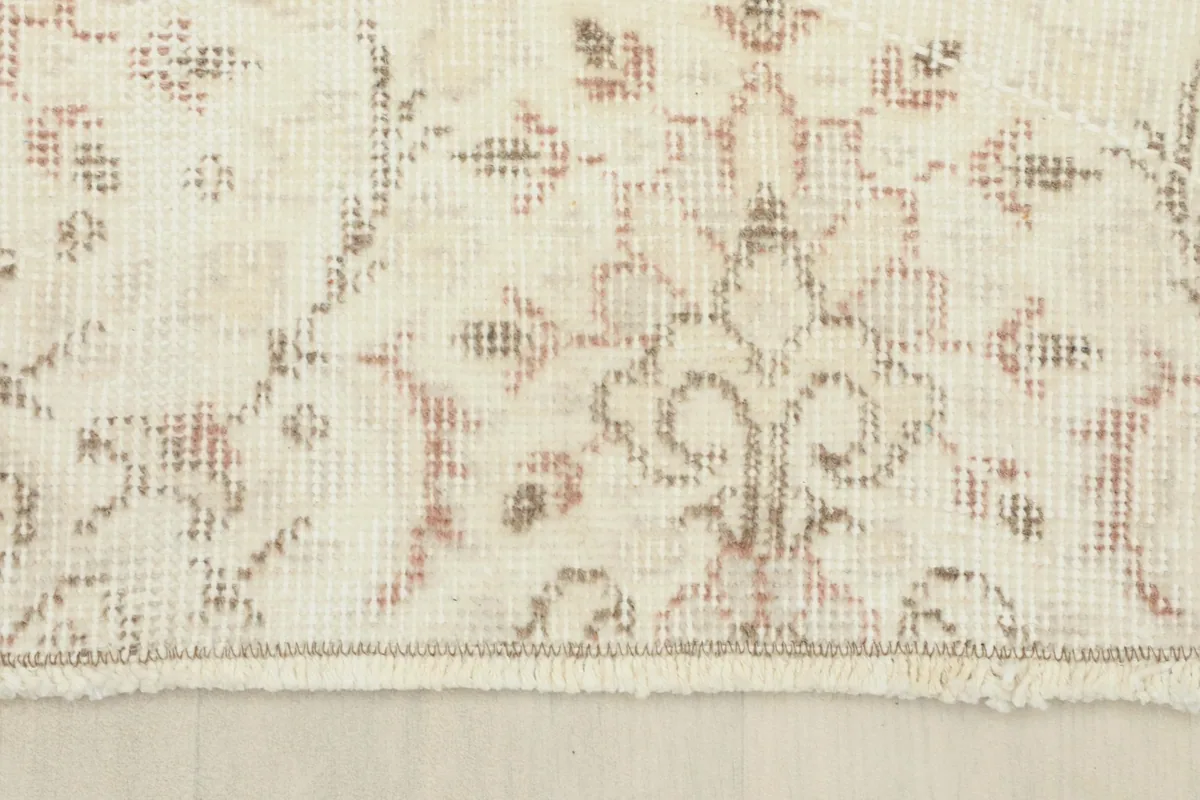 Close-up of the short, neatly finished fringe and border of the vintage Anatolian rug