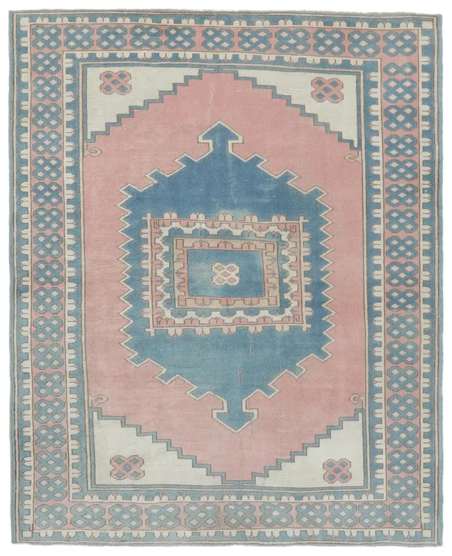 Full top view of the 6'4" x 7'7" vintage Anatolian rug with pink field and blue geometric medallion