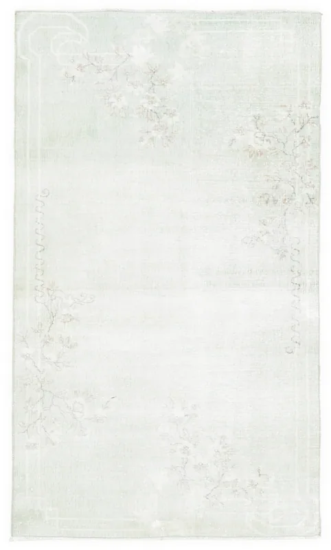 Full top view of the 4x7 rose green floral vintage Anatolian rug on a white background
