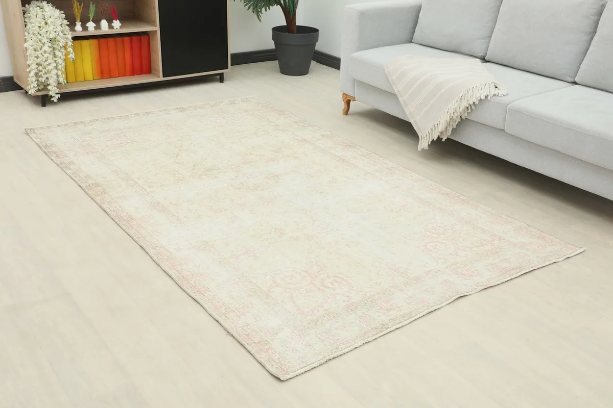 Close-up room view of the 5x8 vintage rug, highlighting its placement and subtle patterns