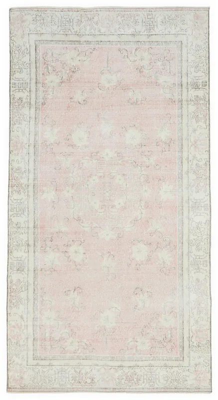 Full overhead view of the 5x6 rose and cream Anatolian vintage rug on a white background
