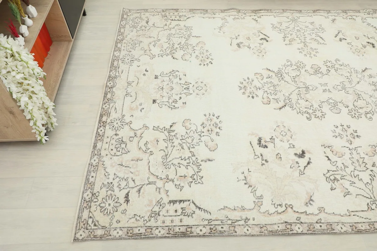 Overhead angle of the rug's surface, highlighting the subtle color variations and motifs.