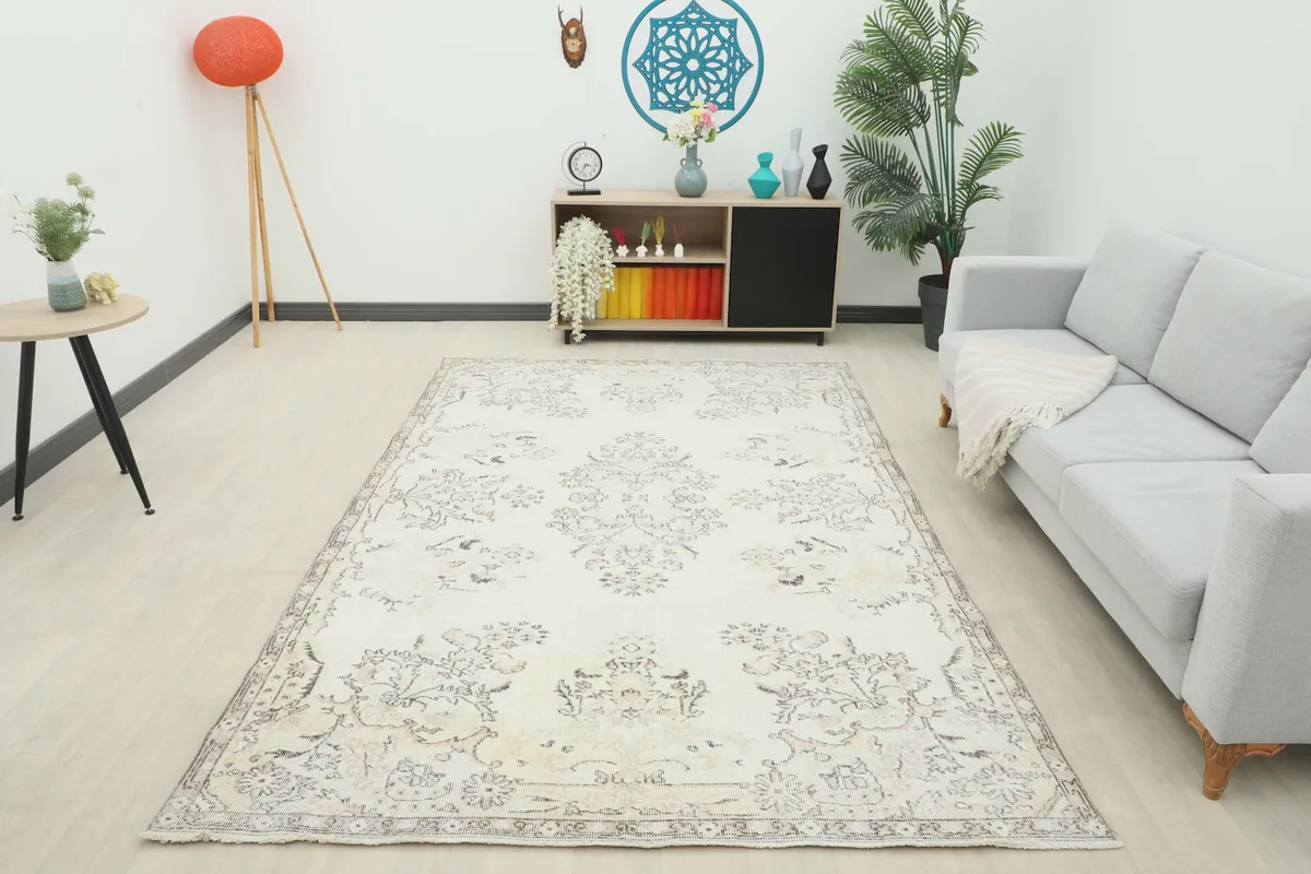 Full room view of the ivory rug, providing context for its size and style in a home setting.