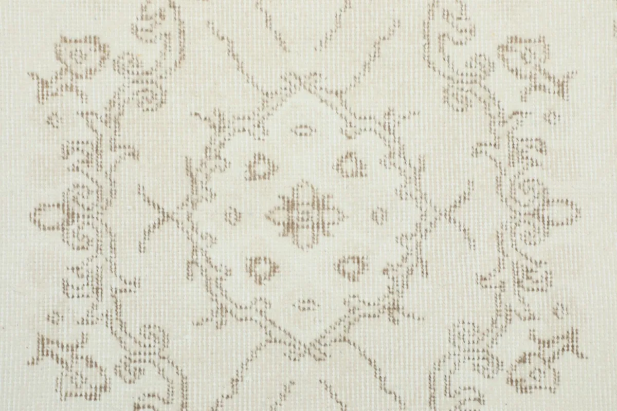 Close-up of the hand-knotted wool pile showing the subtle texture and pattern definition.