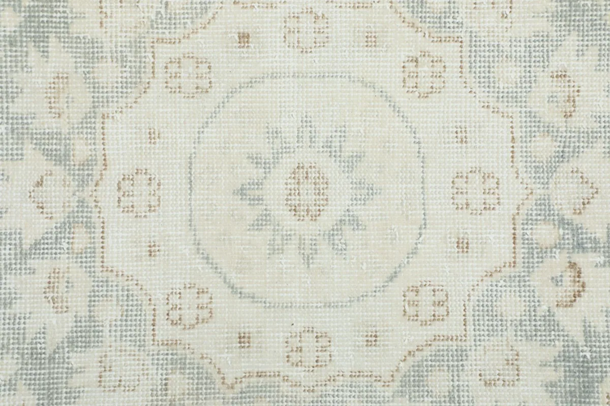 Extreme close-up of the central medallion's intricate floral and geometric details.