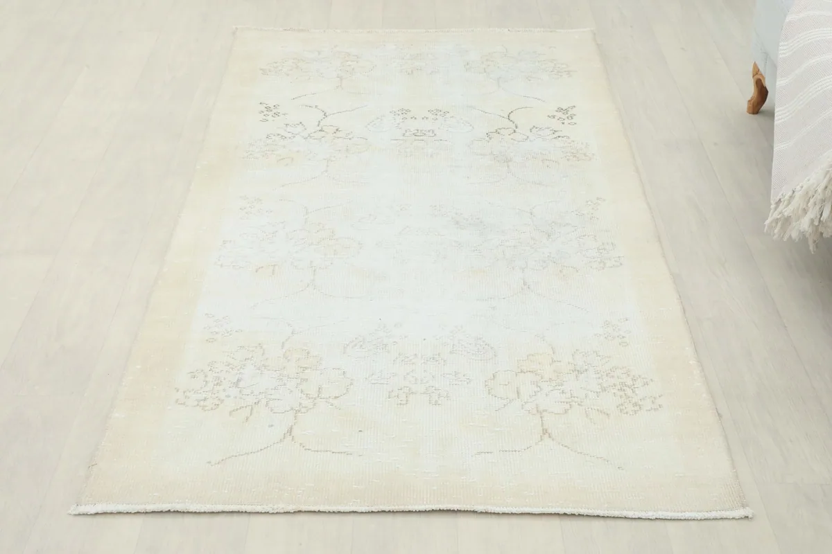 Overhead view of the rug in a room, capturing its full dimensions and soft aesthetic.