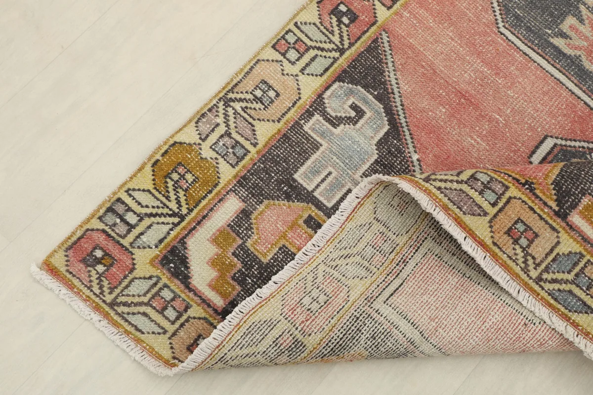 The rug folded to reveal the backside and the quality of the hand-knotted construction