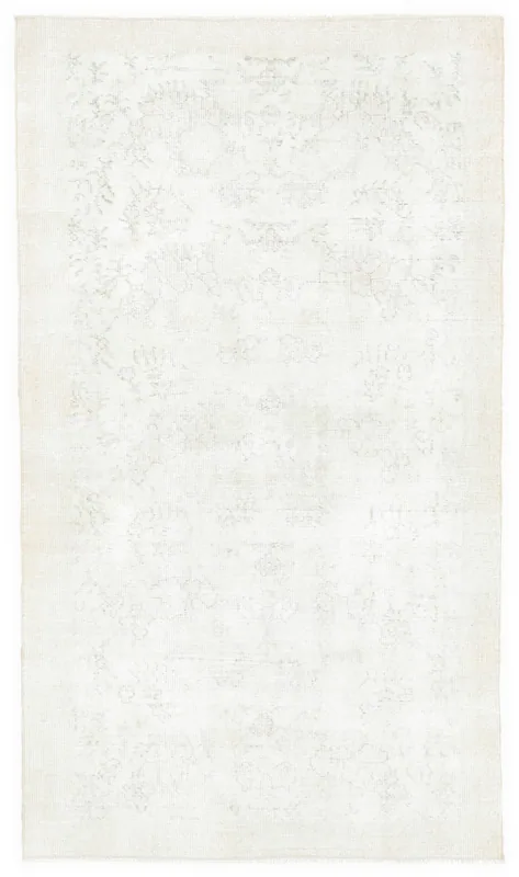 Full overhead view of the cream 4x6 vintage Anatolian rug on a white background