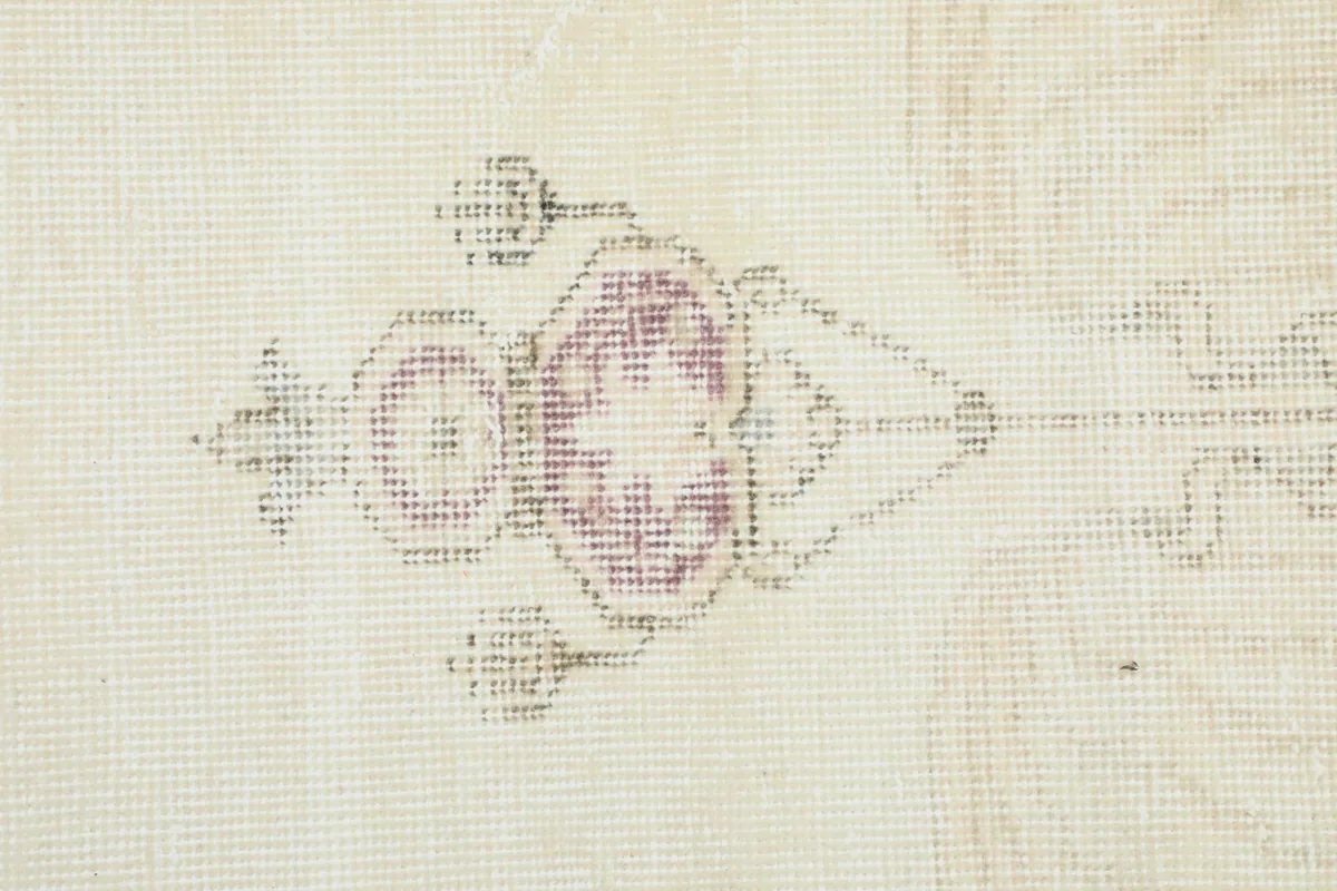 Detailed close-up of the hand-knotted central motif, showing individual knots and colors