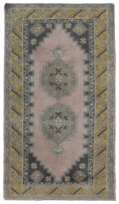 Full top view of the vintage rose, gold, and gray geometric Anatolian rug