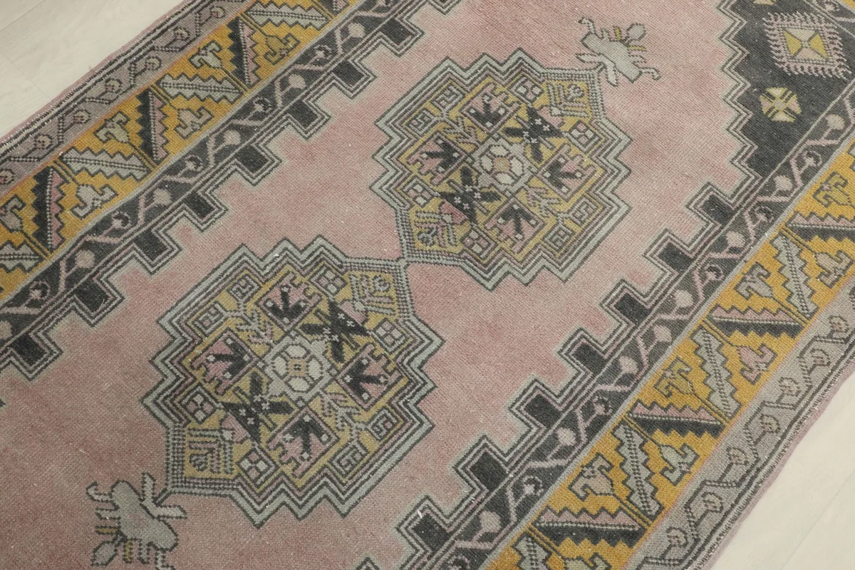 Detailed view of the central geometric medallions and surrounding rose field
