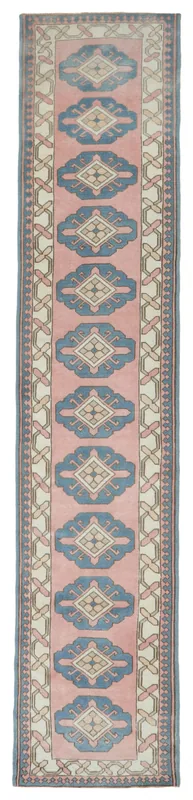 Full overhead view of the 2'11" x 14'3" rose and blue geometric Anatolian runner rug on a white background.