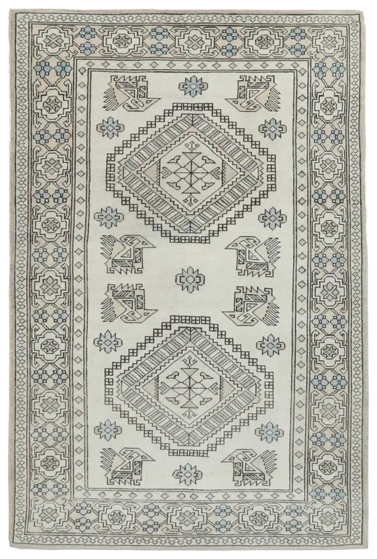 Full overhead view of the 6'4" x 9'6" vintage Anatolian rug with ivory, gray, and blue geometric patterns.
