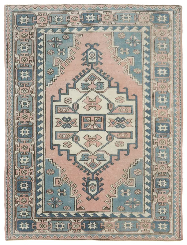 Full top view of the 6'3" x 8'2" vintage Anatolian area rug with rose and blue geometric patterns