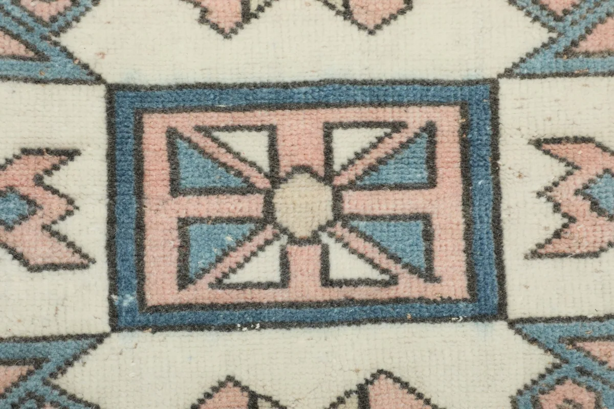 Detailed view of a specific geometric design element within the rug's central pattern