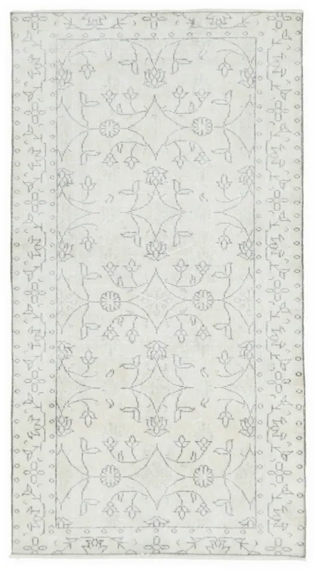 Full top view of the ivory and gray vintage Anatolian area rug on a white background.