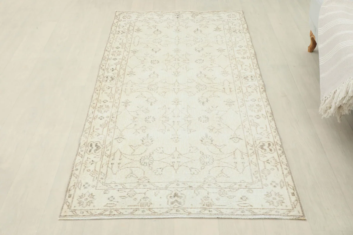Overhead angled view of the Beige Subtle Floral Rug, showing its full length and pattern.