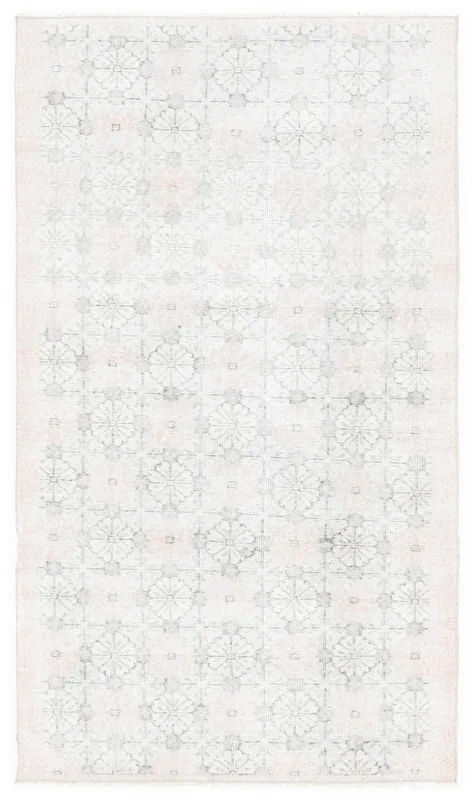 Full overhead view of the 3'10" x 6'8" vintage Anatolian rug with rose and gray geometric pattern