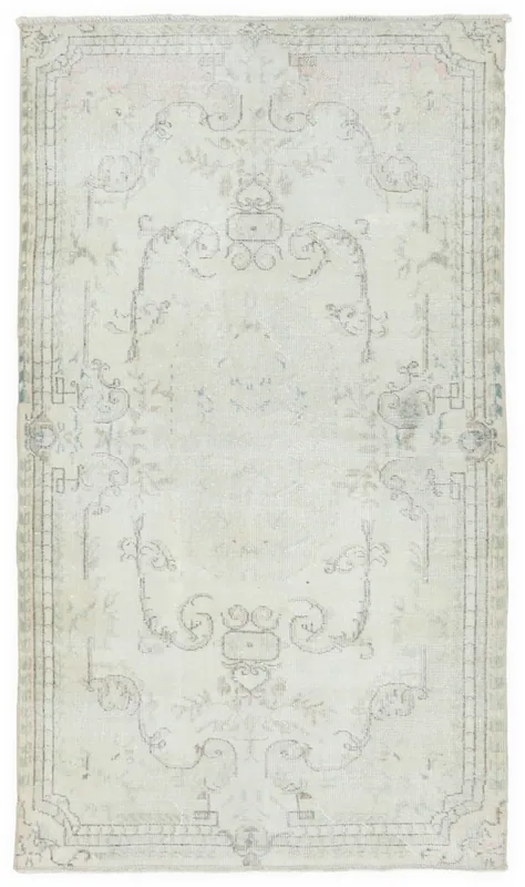 Full top view of the vintage ivory floral Anatolian area rug on a white background
