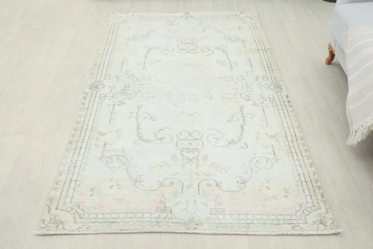 Full overhead view of the ivory rug in a room setting, showcasing its overall appearance