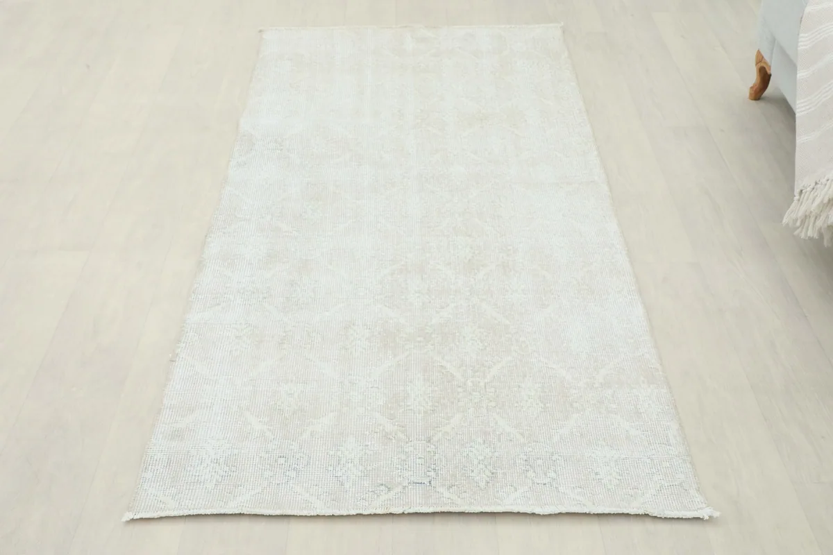 Overhead view of the rug on a light floor, demonstrating its full appearance in a setting