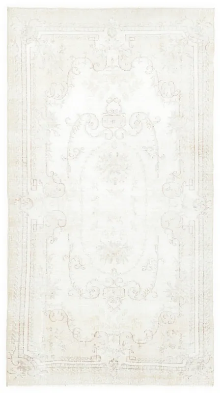 Full overhead view of the beige vintage Anatolian rug with subtle floral medallion