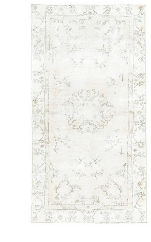 Full top view of the 3'5" x 6'8" hand-knotted vintage Anatolian area rug with an ivory field and medallion motif.