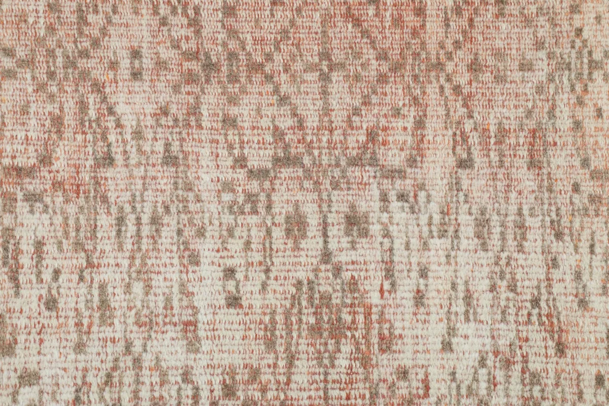 Macro detail of the hand-knotted wool pile, revealing the intricate rose and brown geometric design.