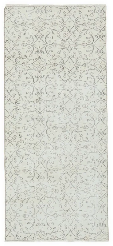 Full overhead view of the 2'9" x 6'3" ivory vintage Anatolian runner rug on a white background.