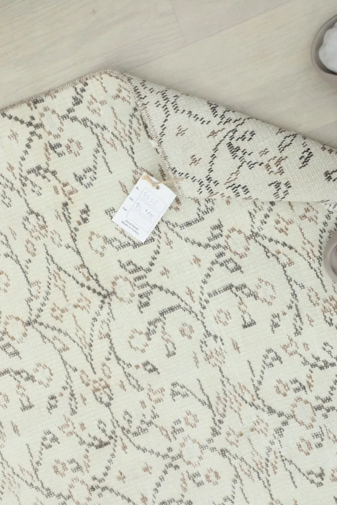 Close-up of the rug's label with product details, visible on the back side of the runner.