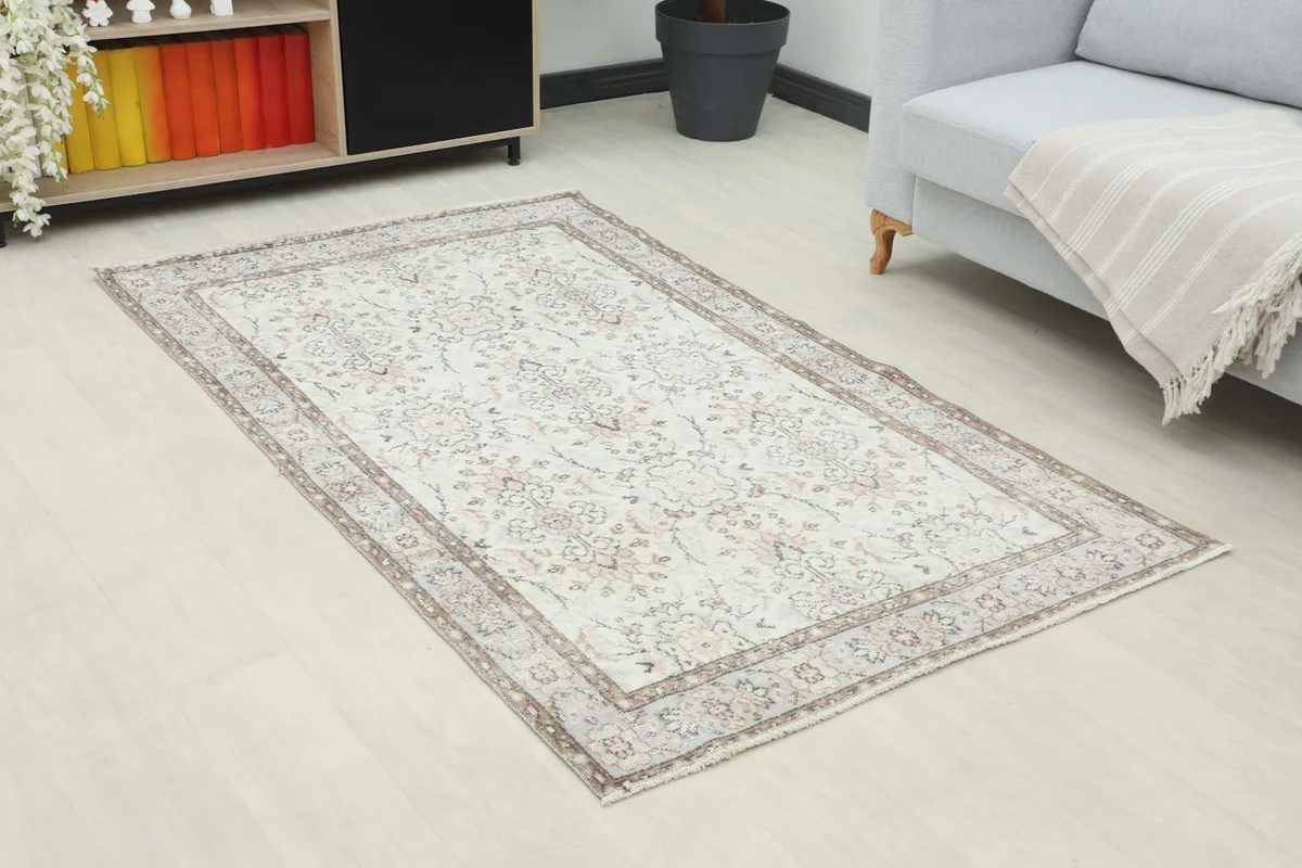 Angle view of the 4x6 vintage Anatolian rug in a room, highlighting its placement