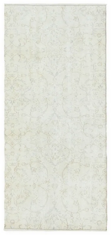 Full top view of a cream floral vintage Anatolian runner on a white background.