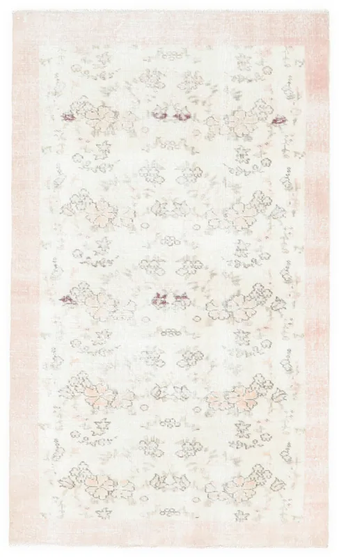 Full top view of the 3'9" x 6'2" vintage Anatolian rug with an ivory field and pink border