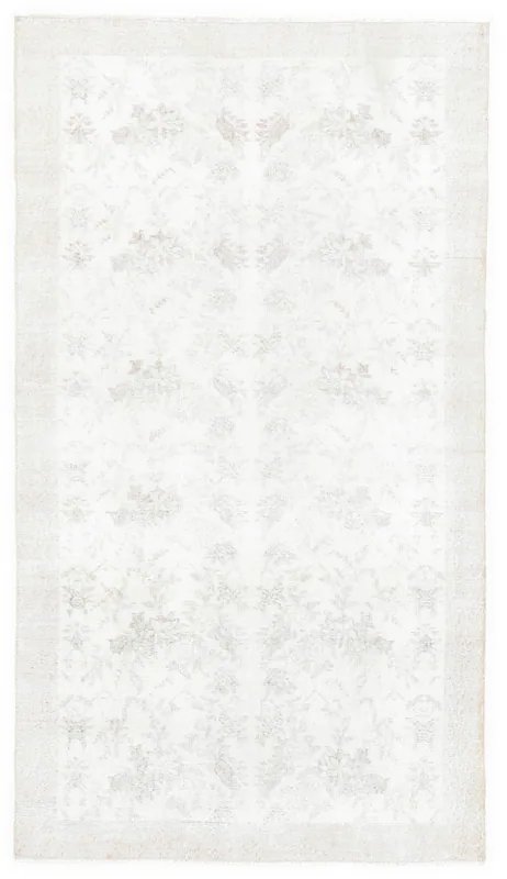 Full overhead view of the 3'9" x 6'9" cream and beige floral vintage Anatolian rug
