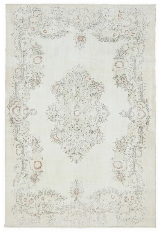 Full top view of the 6'7" x 9'7" ivory vintage Anatolian area rug with floral medallion design.